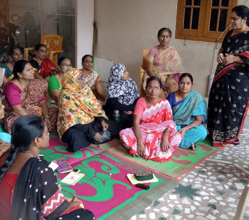 Women participating in a community meeting